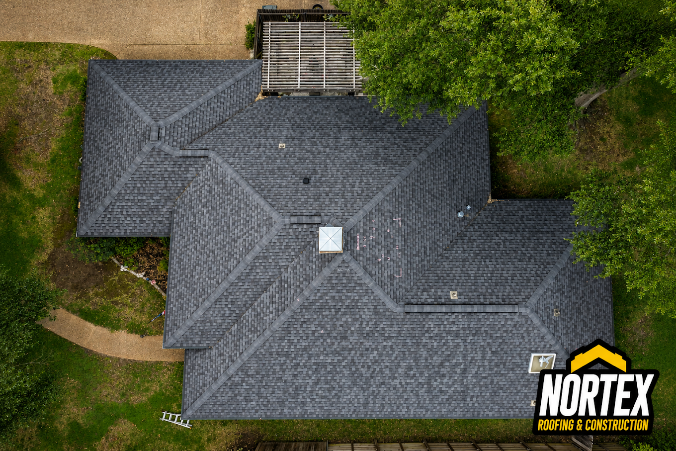 Top-down drone photo of a newly replaced gray shingle roof in Kansas City, MO